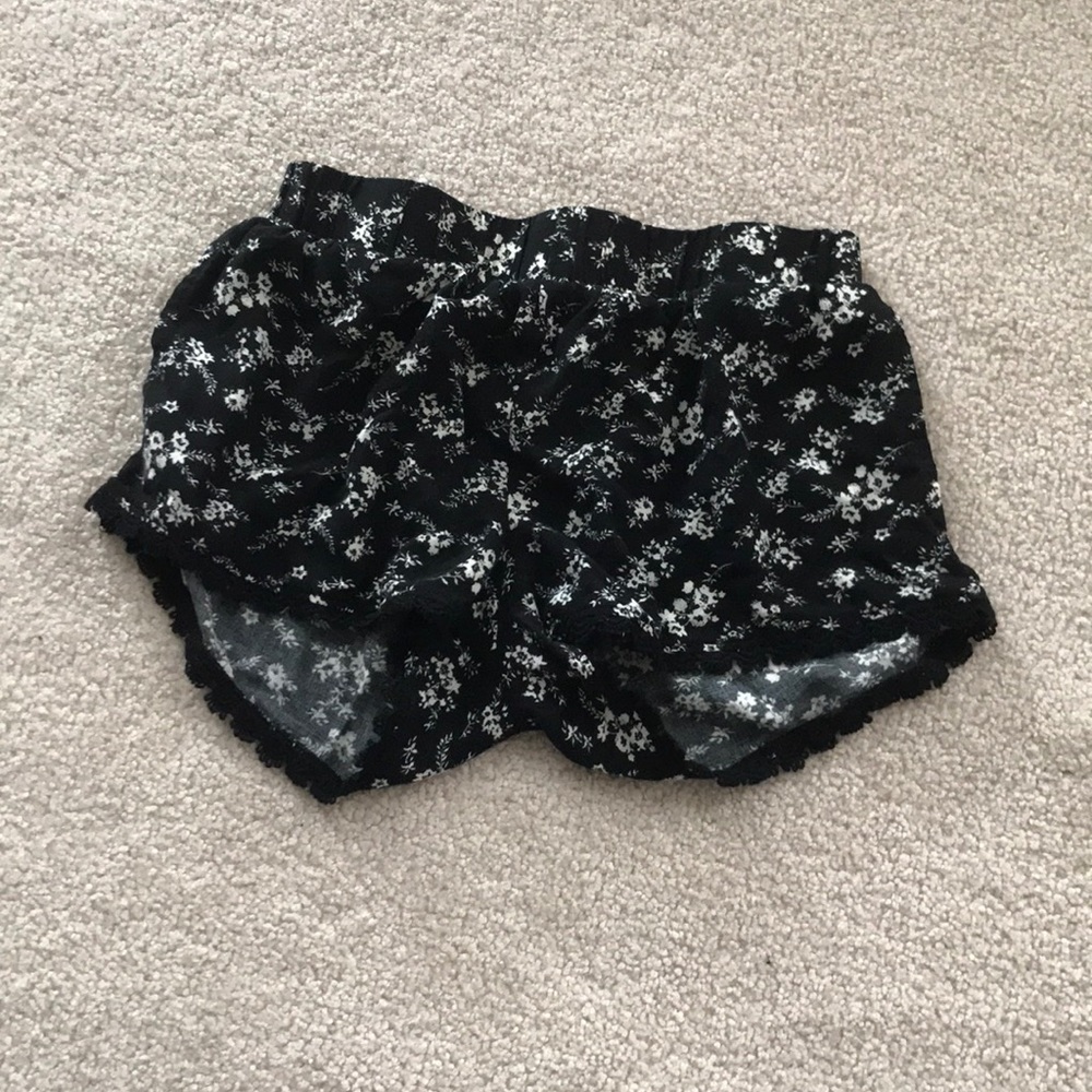 Black shorts with white floral design